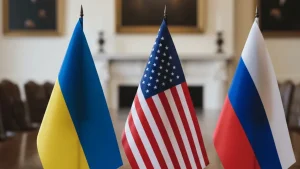 Прапори України, США та Росії на столі в офіційній залі